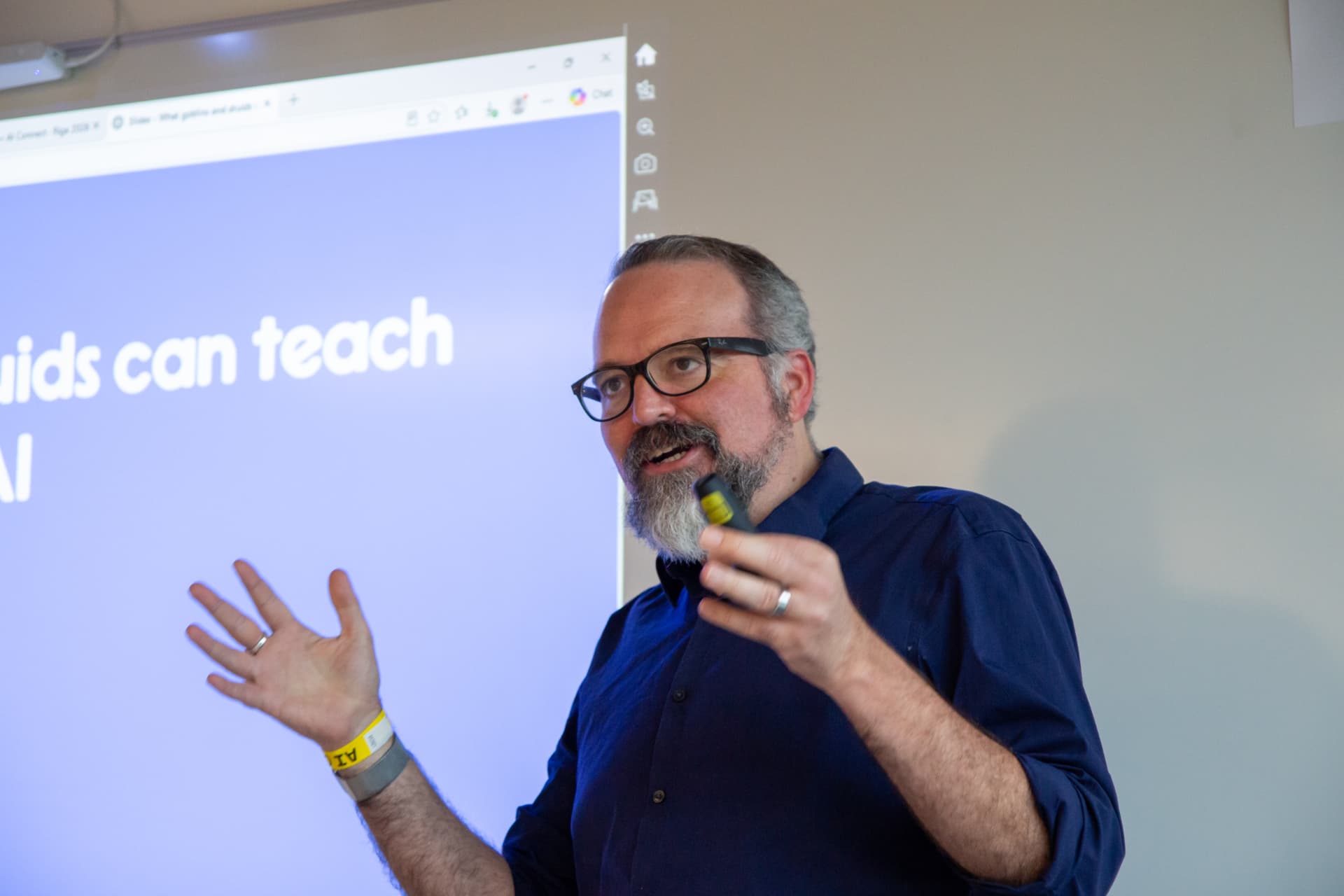 Speaker presenting about what kids can teach AI