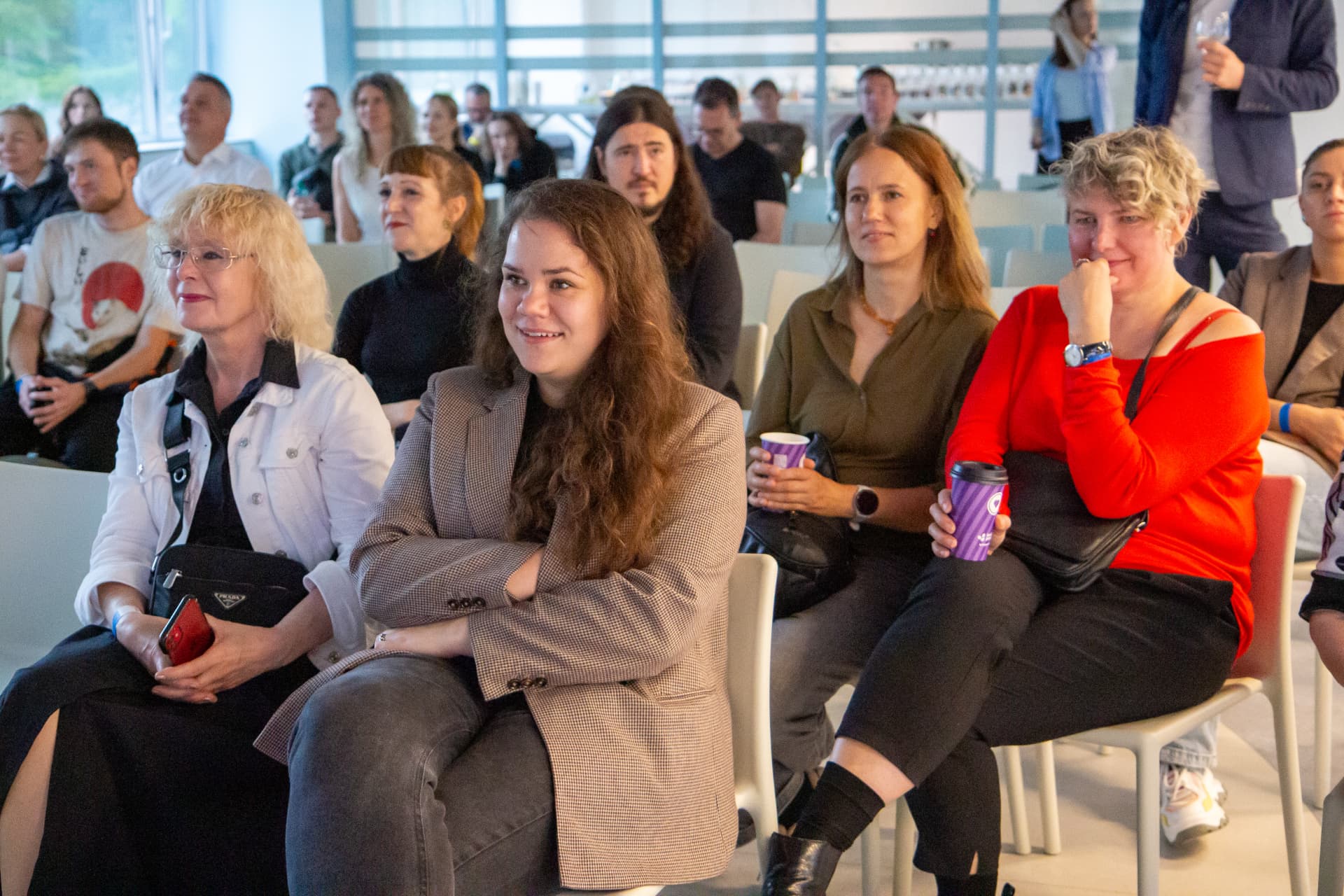 Attendees listening in the main hall